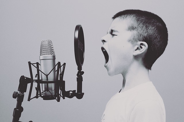 Voice Projection Exercises - Boy Shouting into Microphone